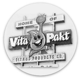 Vita-Pakt mascot and sign